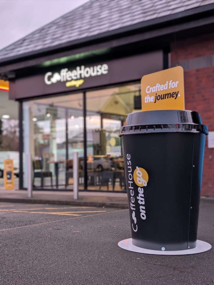 Three's Company Coffee House giant coffee cup outside coffee shop by Three Point Design
