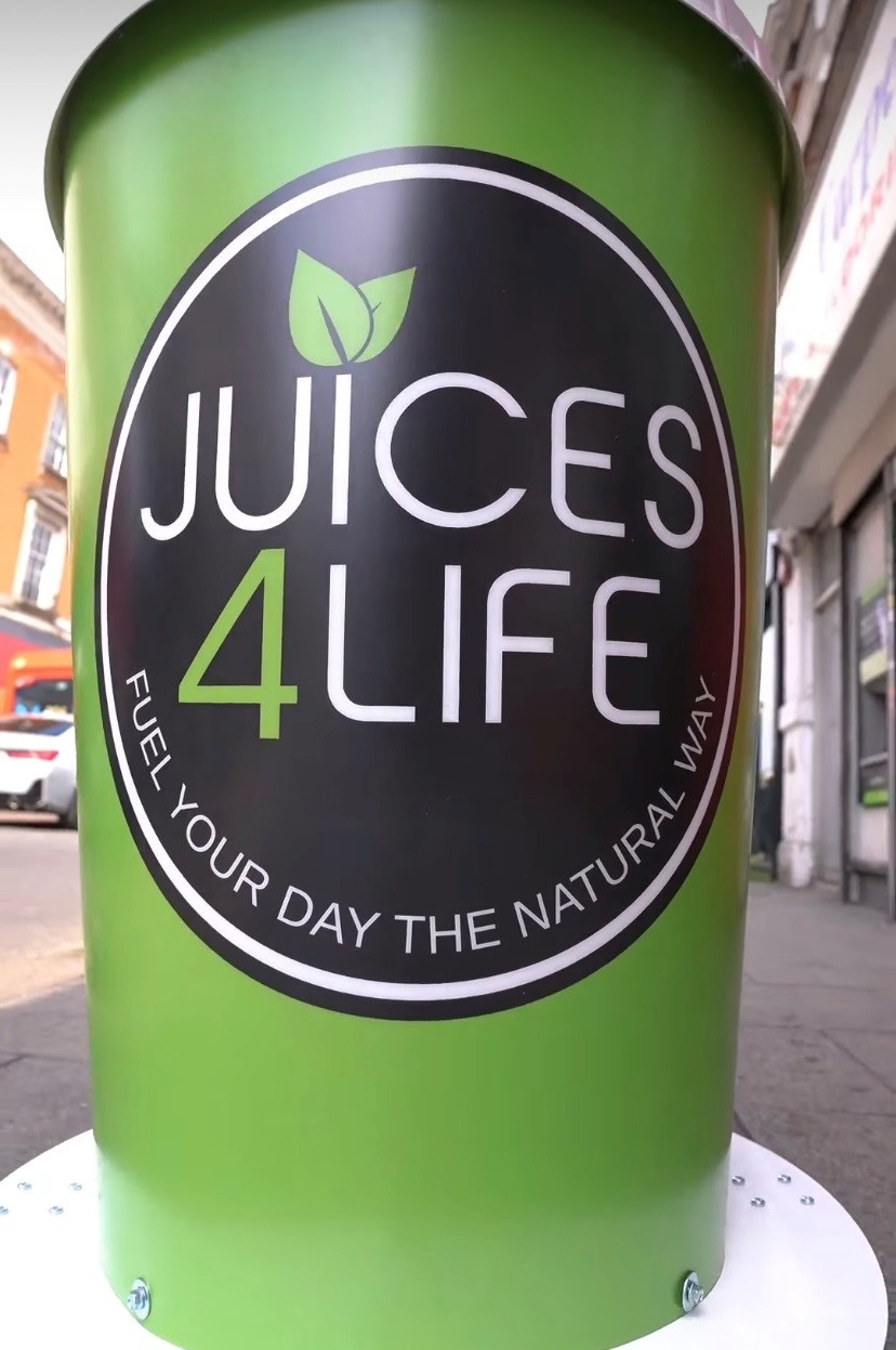 Juices4life new store openings giant cup display by Three Point