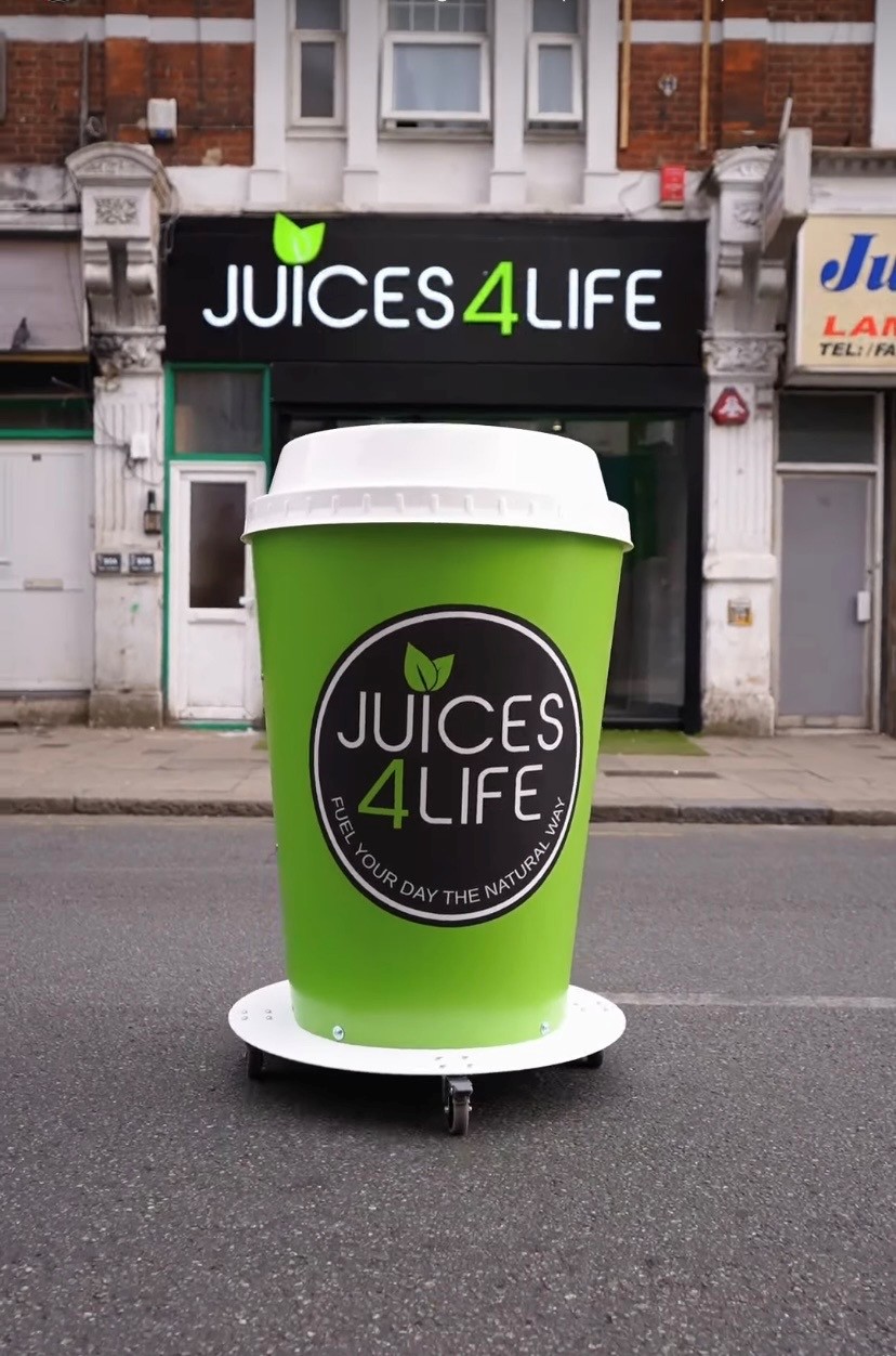 Juices4life new store openings giant cup display by Three Point