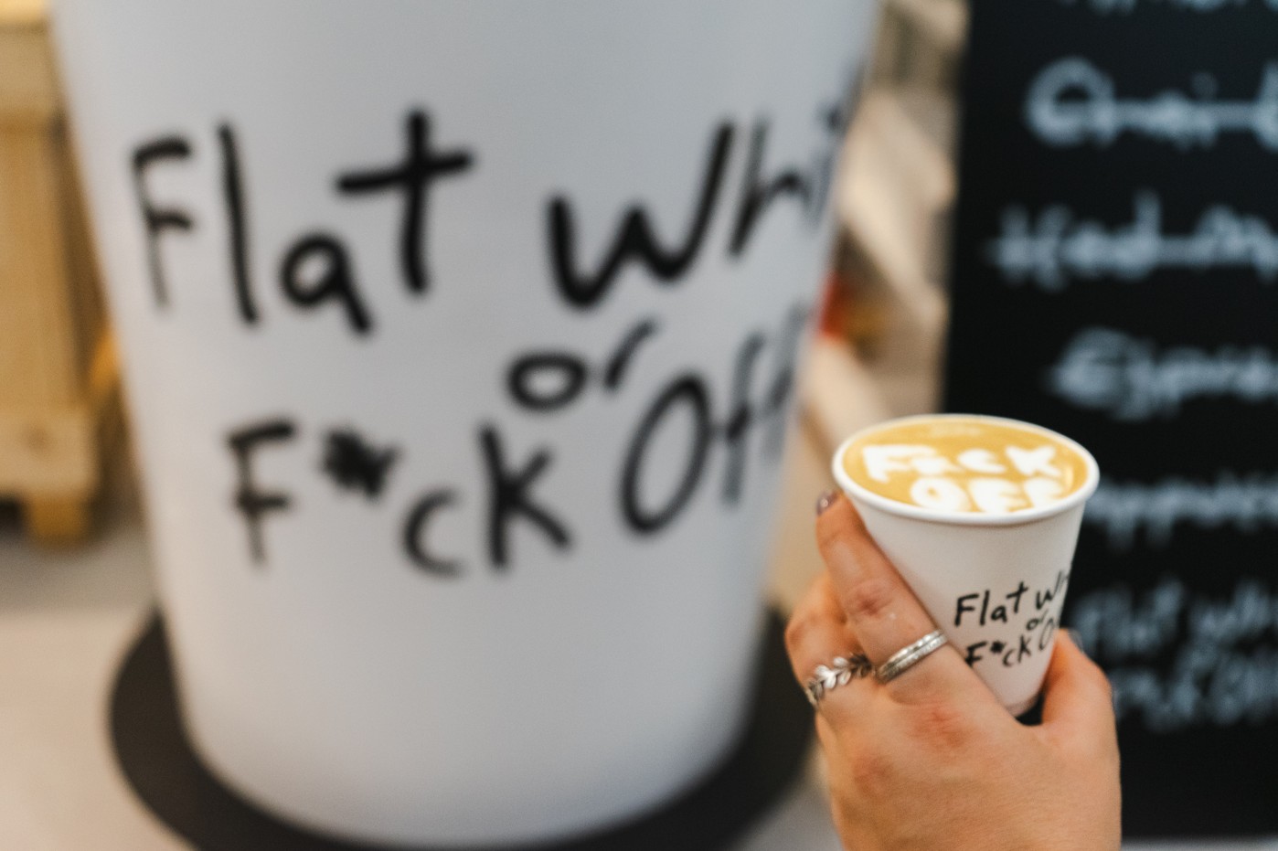 Flat White or F*ck Off with Ask The Impossible at the London Coffee Festival giant coffee cup by Three Point